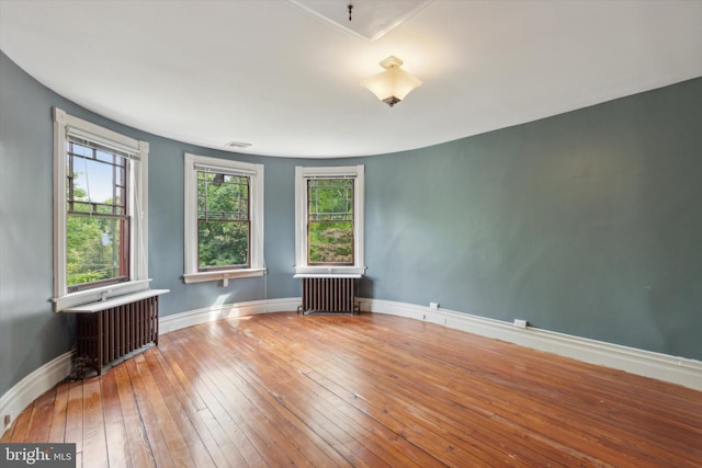 1250 Ashbourne Rd, Elkins Park, PA 19027 - empty room with radiator and wood-type flooring