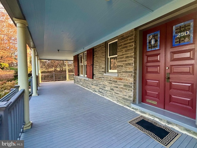 doorway to property with a porch