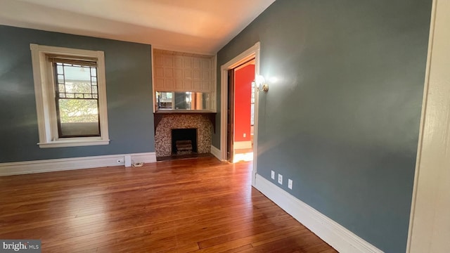 unfurnished living room with wood-type flooring