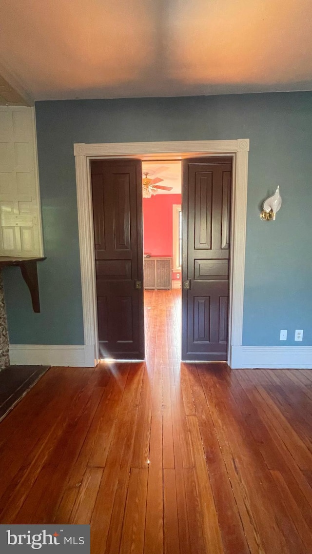 interior space featuring hardwood / wood-style flooring and ceiling fan