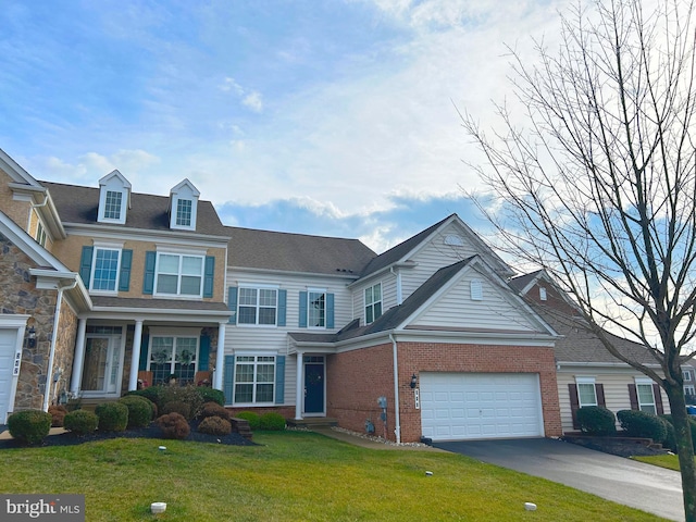 view of front facade featuring a garage and a front yard