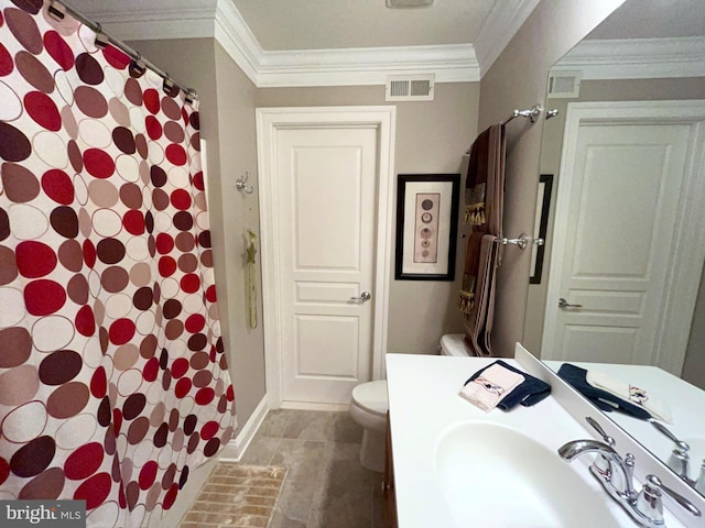 bathroom featuring vanity, toilet, and ornamental molding