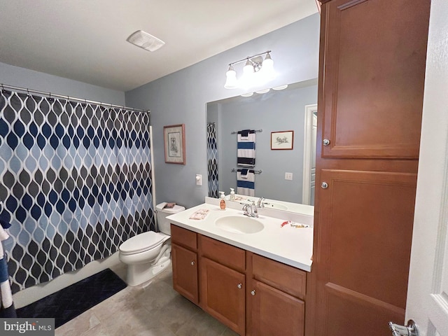 bathroom with vanity, toilet, and walk in shower