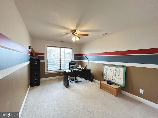 office with carpet floors and ceiling fan