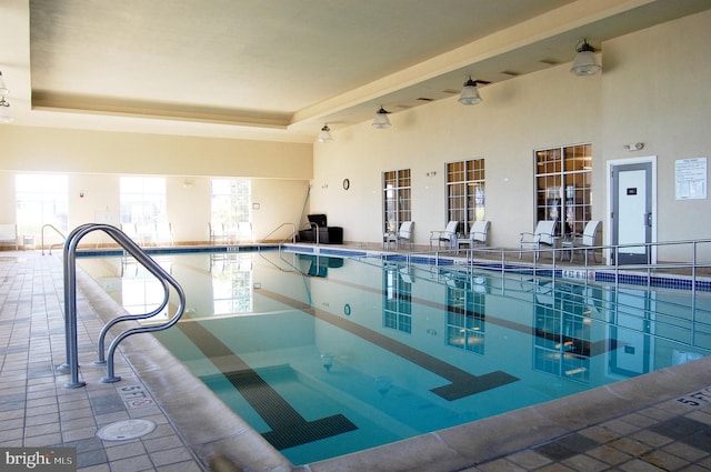 view of swimming pool featuring ceiling fan