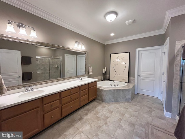 bathroom with crown molding, vanity, and shower with separate bathtub