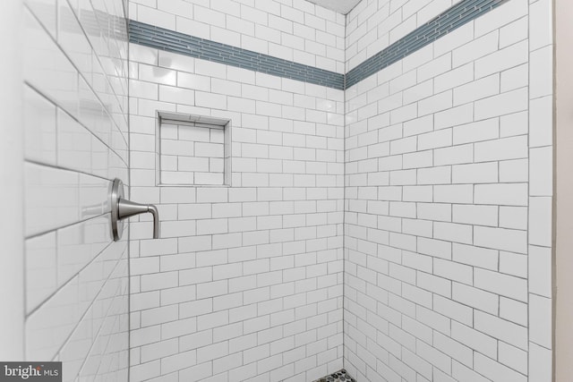 bathroom with a tile shower