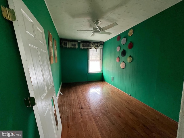 unfurnished bedroom featuring ceiling fan and hardwood / wood-style floors