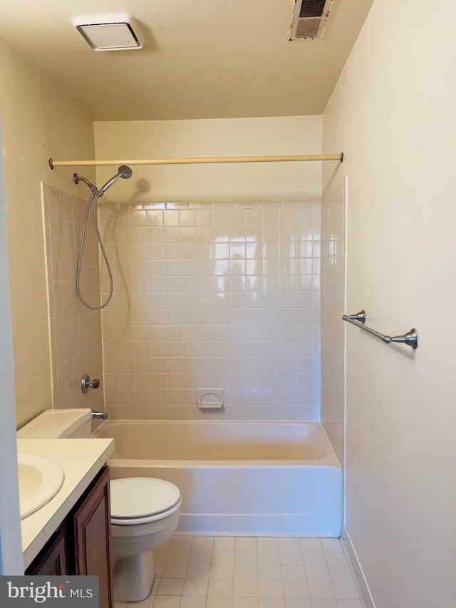 full bathroom with tile patterned floors, vanity, toilet, and tiled shower / bath