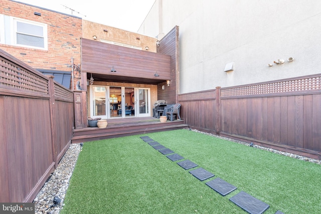 view of yard featuring a wooden deck