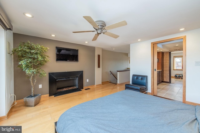 bedroom featuring ceiling fan and light wood-type flooring