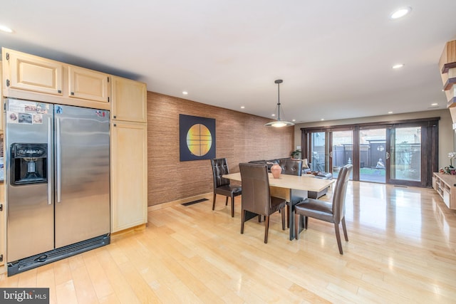 dining space featuring light hardwood / wood-style floors