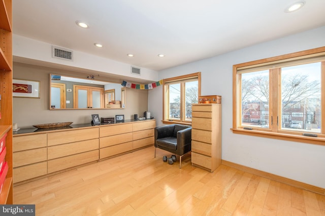 sitting room featuring light hardwood / wood-style flooring