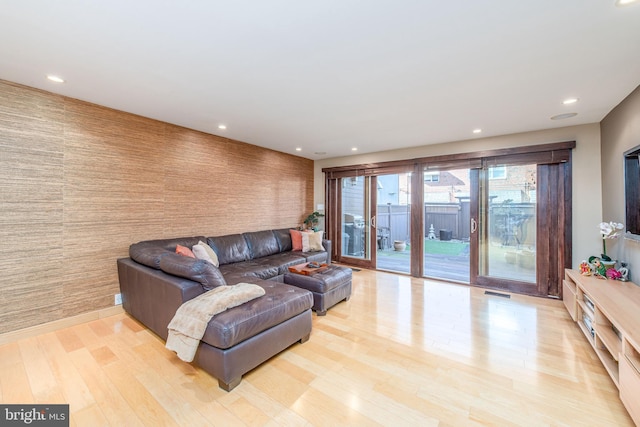 living room with light hardwood / wood-style flooring