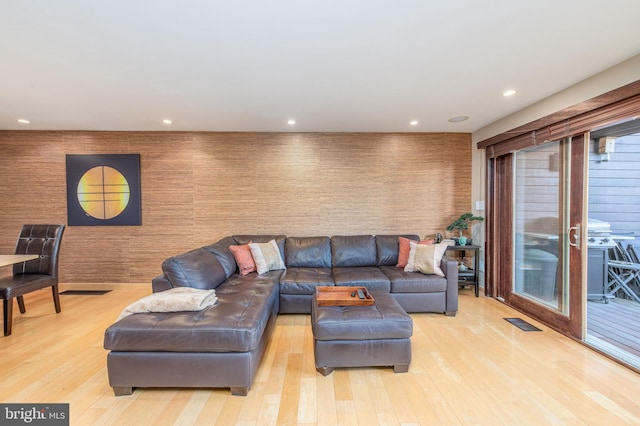 living room with light hardwood / wood-style floors