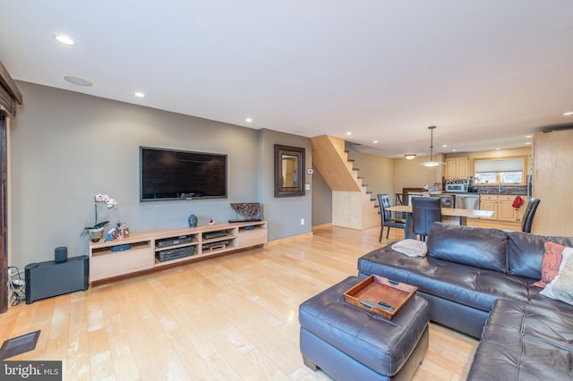 living room with light hardwood / wood-style flooring