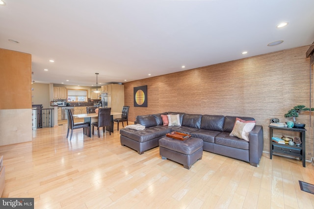 living room with light hardwood / wood-style flooring