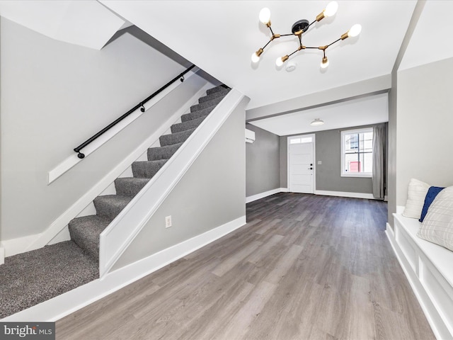 115 Water St, Frederick, MD 21701 - entrance foyer featuring baseboards, stairway, a chandelier, and wood finished floors