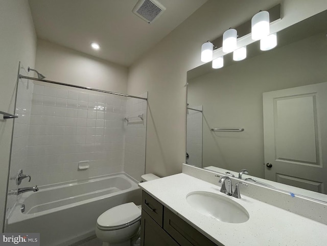 full bathroom with bathtub / shower combination, vanity, and toilet