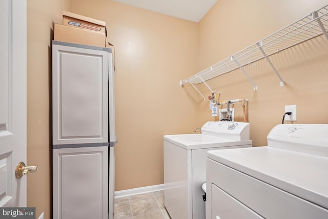 laundry area featuring washing machine and clothes dryer