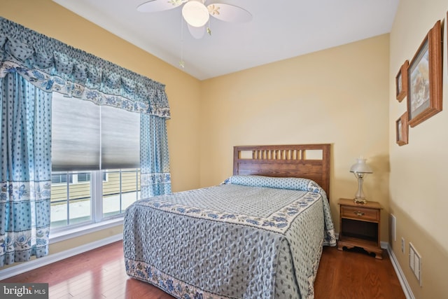 bedroom featuring ceiling fan and hardwood / wood-style floors