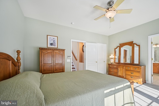 bedroom featuring ceiling fan and ensuite bathroom