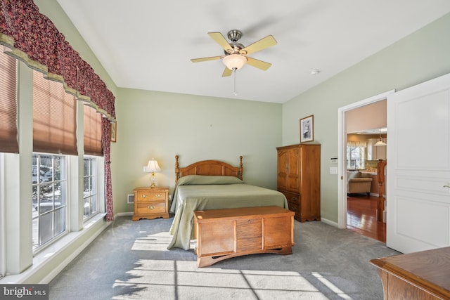 carpeted bedroom with ceiling fan