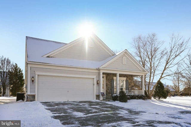 view of front of property with covered porch and a garage