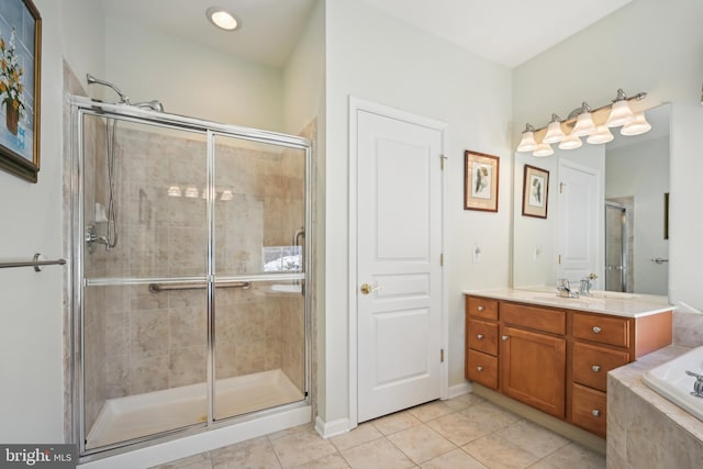 bathroom with independent shower and bath, tile patterned flooring, and vanity