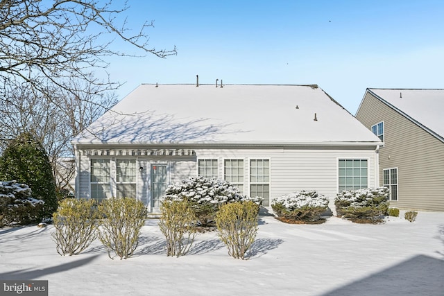 view of snow covered house