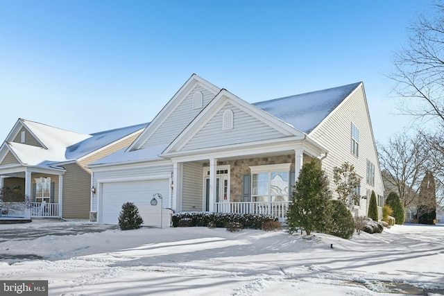 view of front facade with covered porch and a garage