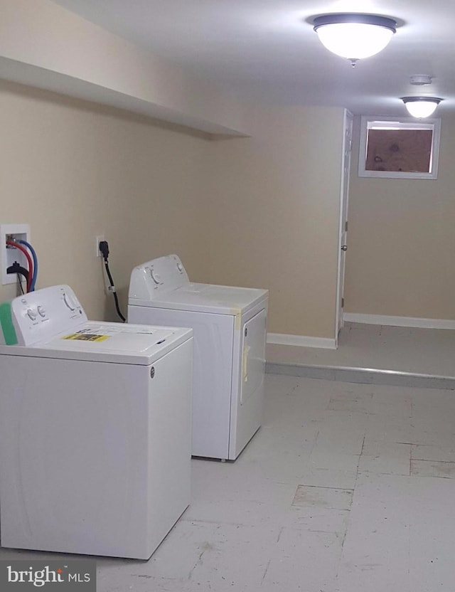 washroom with independent washer and dryer