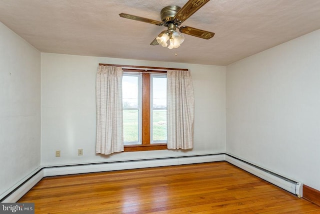 spare room featuring ceiling fan, a textured ceiling, and hardwood / wood-style flooring