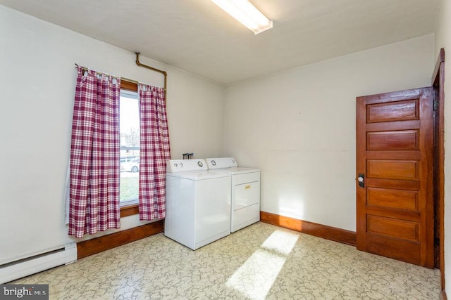 laundry room featuring washing machine and dryer and a baseboard radiator