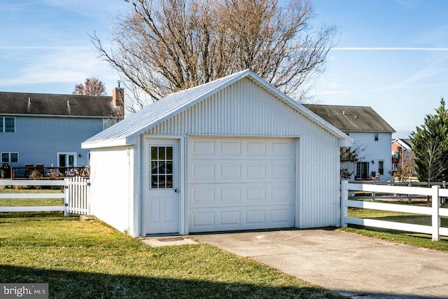 garage featuring a yard