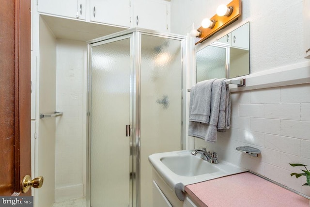 bathroom with vanity and walk in shower