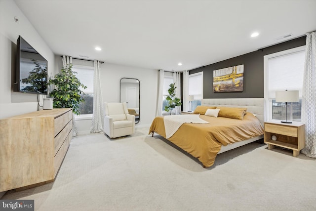 bedroom featuring light colored carpet