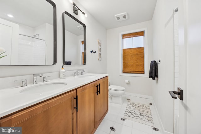 bathroom featuring walk in shower, tile patterned flooring, vanity, and toilet