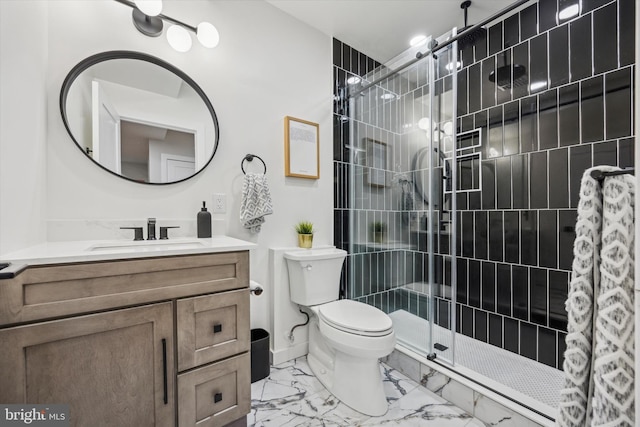 bathroom featuring vanity, an enclosed shower, and toilet