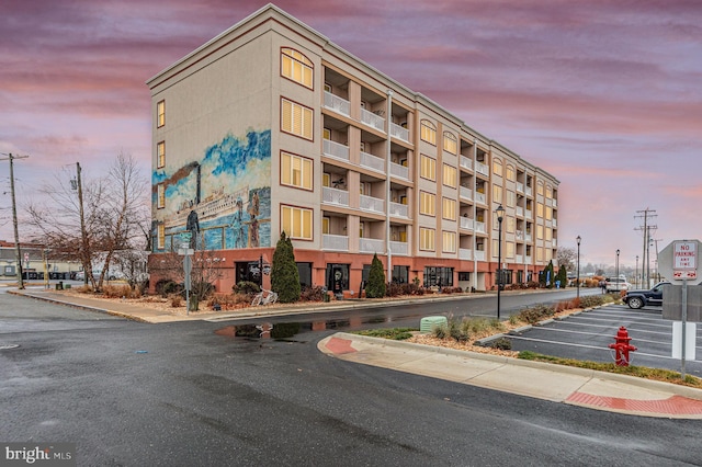 view of outdoor building at dusk