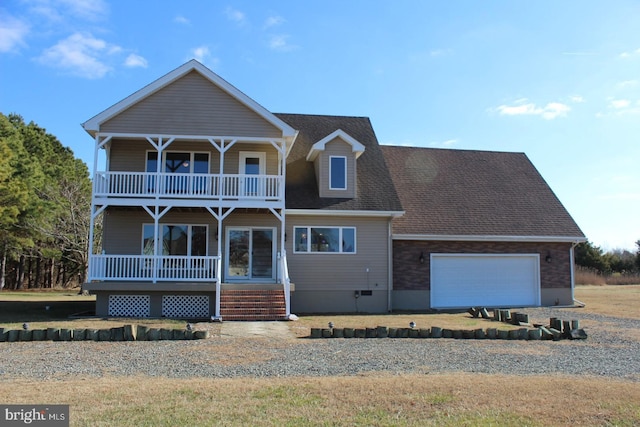 view of front of property featuring covered porch and a garage