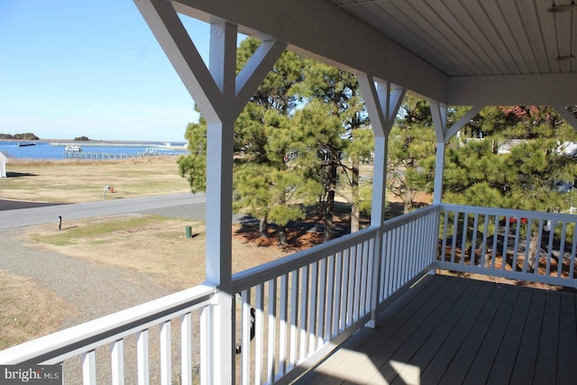 wooden terrace with a water view