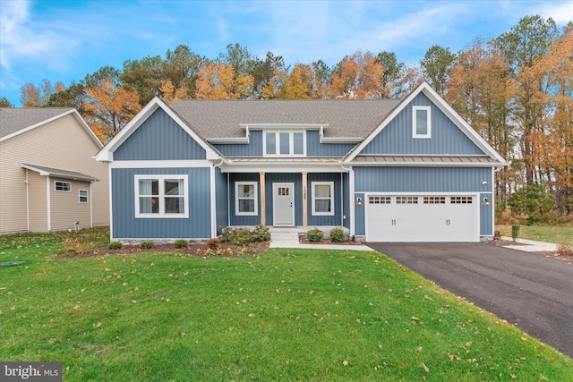 view of front of home featuring a garage and a front yard