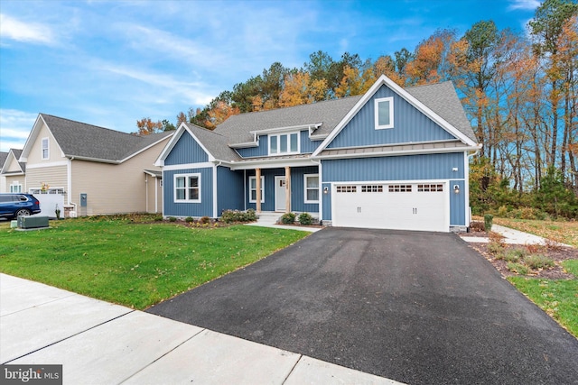 craftsman-style home with a front yard and a garage