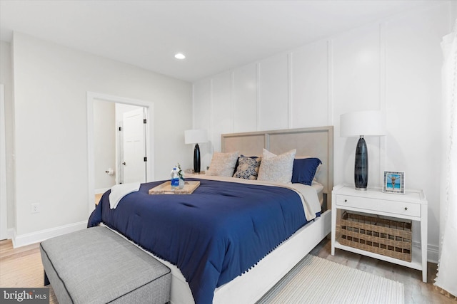 bedroom with wood-type flooring