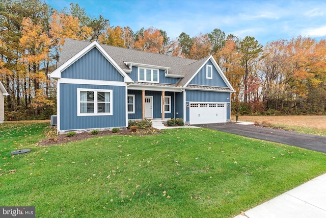 view of front of home featuring a front yard and a garage