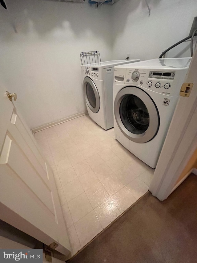 washroom featuring washer and dryer