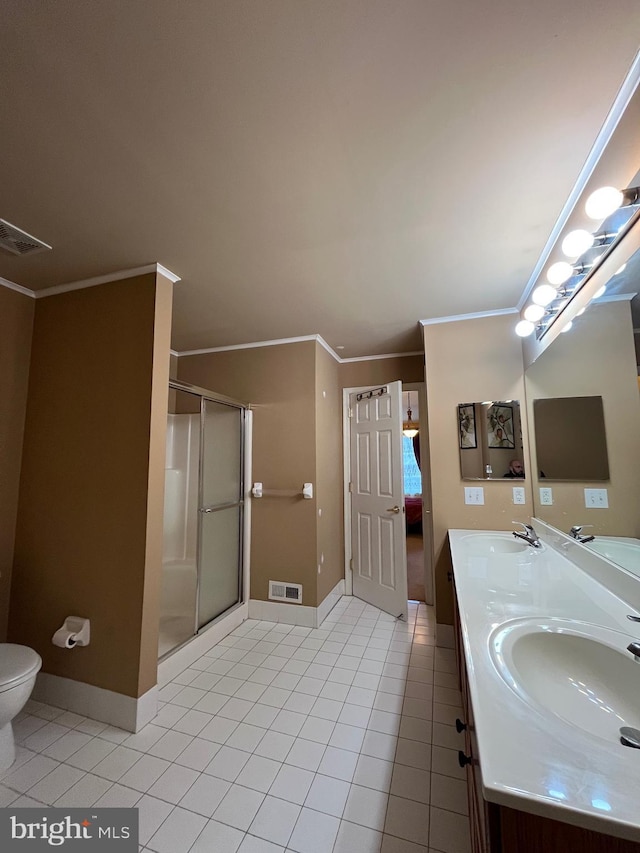 bathroom featuring vanity, tile patterned floors, a shower with shower door, and crown molding