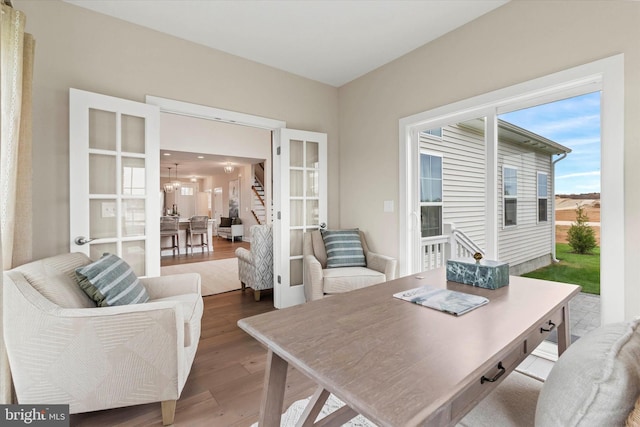 office space with hardwood / wood-style floors and french doors