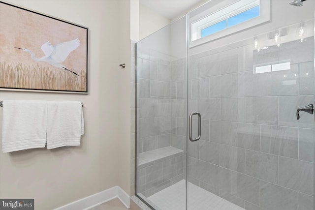 bathroom with a shower with shower door